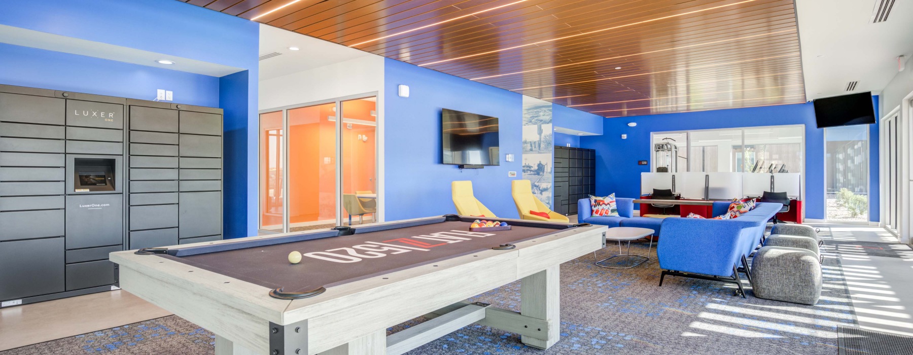 Indoor entertainment space with billiards and TV lounge, Large windows, LED lighting