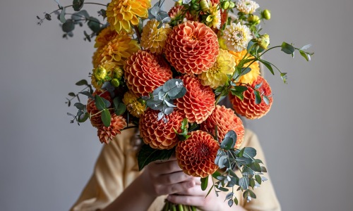 woman holding a bouquet of flowers